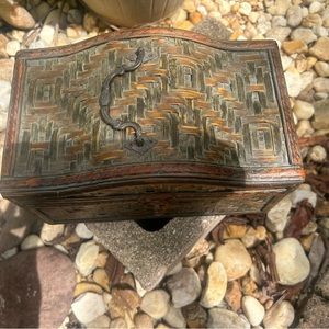 Vintage wicker storage chest with brass plated clamp